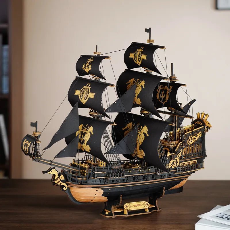 ROKR The Seahorse Barque 3D wooden ship puzzle featuring black sails with gold accents in a detailed side view.
