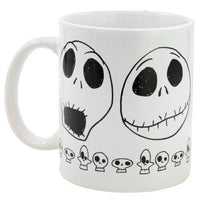 White ceramic 11oz Jack Skellington mug featuring black line-art faces and a border of small skulls.