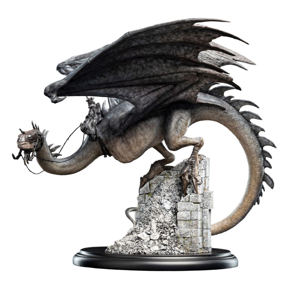 Side view of Weta Workshop Fell Beast mini statue, featuring a detailed grey dragon perched on stone ruins.