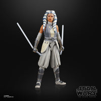 Star Wars action figure of Ahsoka Tano holding lightsabers on a black background